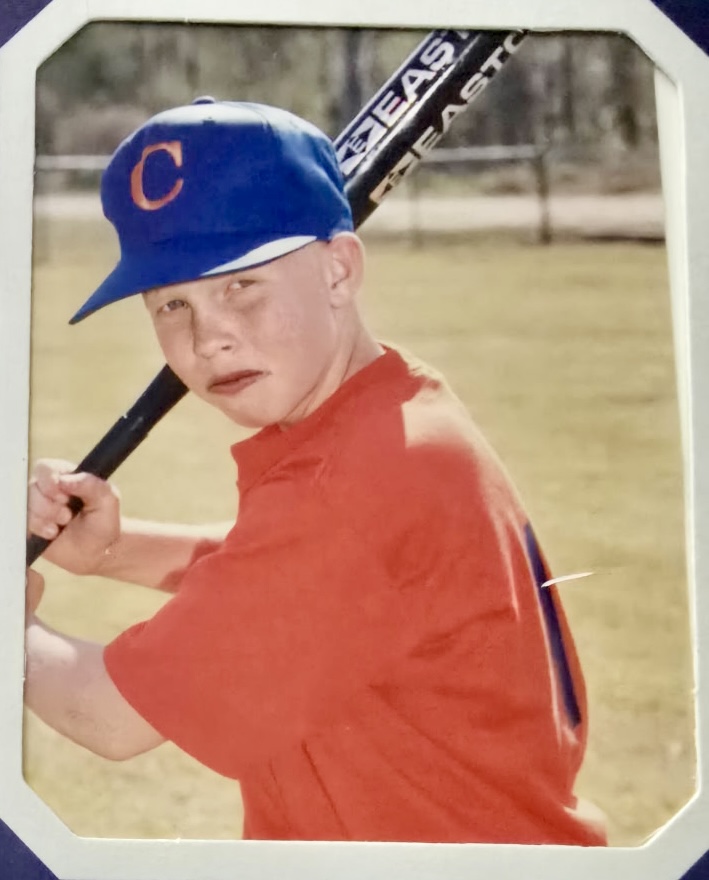 Young Cody Barrs Baseball Player in Orange