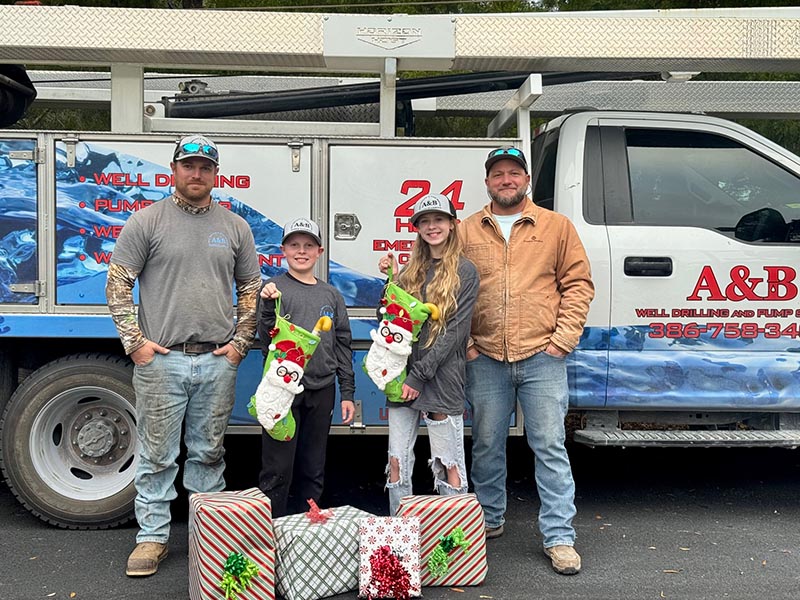 2025 Toy Drive Posing with Presents